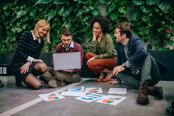 Digital marketing team discussing social media growth strategy - Digi Brand Nova
