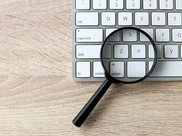 Keyword Research and Optimization Service - Keyboard with magnifying glass - Digi Brand Nova